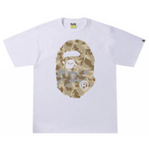 BAPE Sand Camo Big Ape Head Tee White/Beige "White and beige T-shirt featuring a sand camo pattern with a large ape head graphic, blending a unique design with a stylish streetwear look from BAPE."