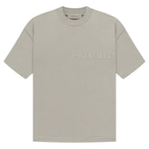 FEAR OF GOD ESSENTIALS SS TEE SEAL "Seal-colored short-sleeve T-shirt from showcasing a simple yet contemporary design with a relaxed fit."