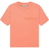 Fear of God Essentials T-shirt Coral "Coral T-shirt from FEAR OF GOD ESSENTIALS, featuring a minimalist design and a relaxed fit, ideal for a comfortable and stylish look."