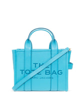 "Marc Jacobs Barrier Reef The Tote Small Satchel for women, featuring a vibrant blue color reminiscent of ocean hues. The satchel includes top handles and a spacious interior, combining a chic design with functionality for everyday use."