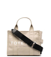 Marc Jacobs Beige Logo Small Satchel crafted in polypropylene for women.
The satchel includes top handles and a detachable shoulder strap, offering a stylish and versatile option for everyday use.