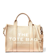 Marc Jacobs Beige The Tote Medium Satchel for women, featuring a neutral beige color and a spacious design. The satchel includes sturdy top handles and a versatile interior, making it a stylish and practical choice for daily use."
