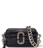 Marc Jacobs Black Snapshot Mini Crossbody Bag for women, featuring a classic black color and a compact design. The bag includes an adjustable strap and the iconic logo, offering a stylish and versatile accessory for daily use.