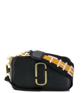 Marc Jacobs Black Snapshot Small Crossbody Bag for women, featuring a classic black design with a compact silhouette. The bag includes an adjustable strap and the iconic logo, making it a versatile and stylish accessory for everyday use."