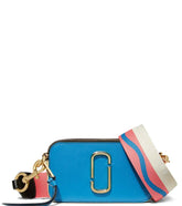 "Marc Jacobs Blue Snapshot Small Crossbody Bag for women, featuring a vibrant blue color and a compact design. The bag includes an adjustable strap and the signature logo, making it a stylish and versatile accessory for everyday outings."