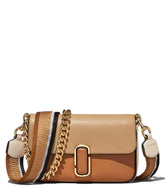 "Marc Jacobs Brown The J Small Crossbody Bag for women, featuring a rich brown color and a compact design. The bag includes an adjustable strap and the signature logo, making it a stylish and versatile accessory for everyday use."