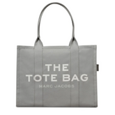 "Marc Jacobs Grey The Large Tote Bag for women, featuring a spacious and versatile design with sturdy handles. Crafted from durable materials, this bag combines a chic aesthetic with practicality, perfect for everyday use."