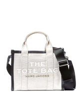 "Marc Jacobs Off White The Summer Mini Satchel for women, featuring a soft off-white color and a compact design. The satchel includes top handles and a detachable shoulder strap, making it a stylish and versatile.
