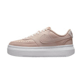 Nike Court Vision Alta Pink Oxford, sneakers in "Pink Oxford," featuring a soft pink leather upper with white accents. The design includes a low-top silhouette, perforated details for breathability, and a white midsole, displayed against a neutral background to emphasize the shoe's stylish and modern look.