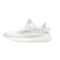 "Adidas Yeezy Boost 350 V2 sneakers in the Bone colorway, featuring a minimalist design with a soft, cream-colored Primeknit upper, a translucent side stripe, and a signature Boost midsole for comfort and style."



