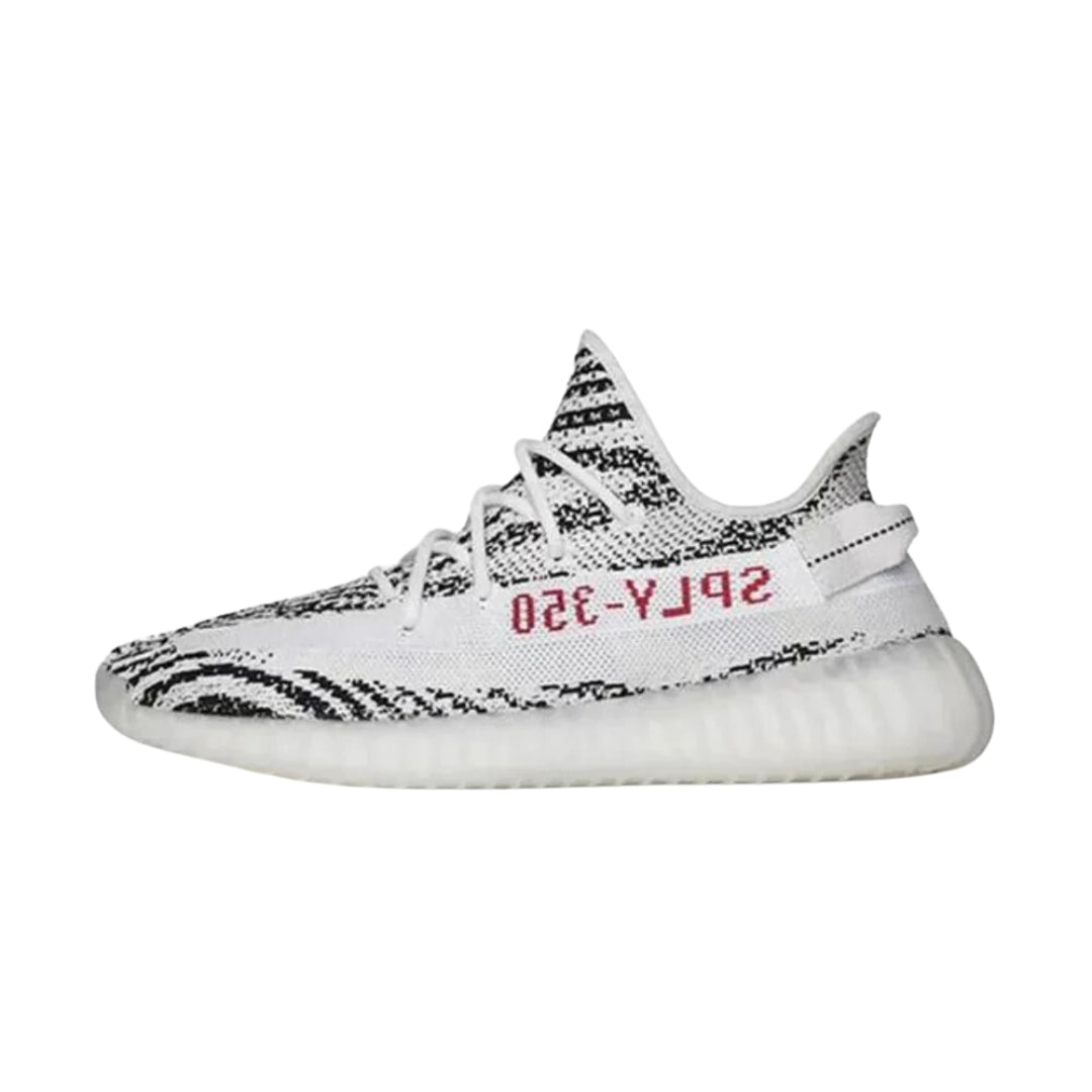 "Adidas Yeezy Boost 350 V2 sneakers in the Zebra colorway, featuring a striking black and white striped Primeknit upper, a translucent side stripe, and a cushioned Boost midsole for both style and comfort."



