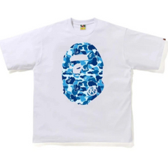 BAPE ABC Camo Big Ape Head Relaxed Tee White/Blue "White and blue relaxed tee featuring the iconic BAPE ABC camo pattern and a large ape head graphic, offering a stylish streetwear look."



