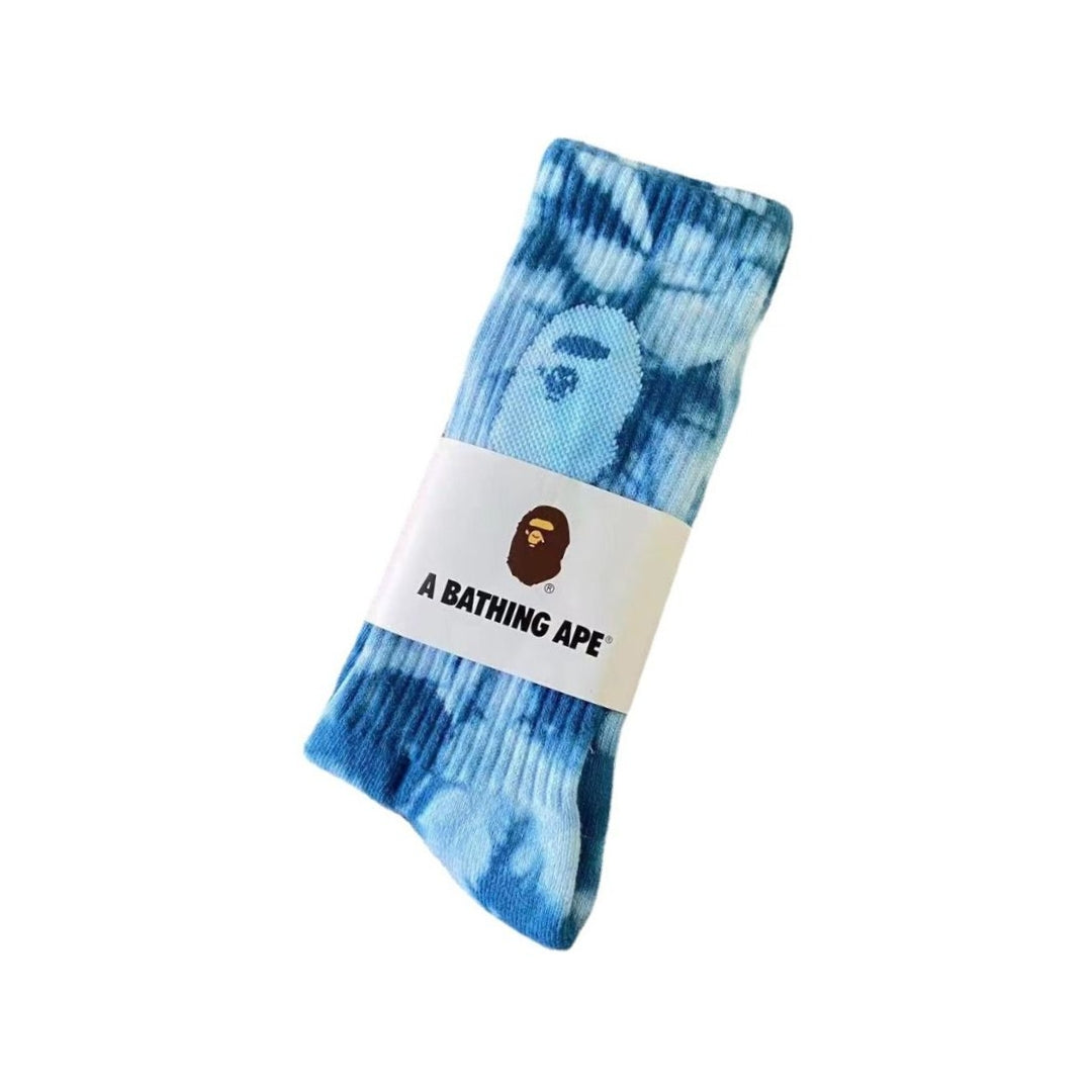 Bape Tie Dye Socks Blue "Blue tie-dye socks from BAPE, featuring a vibrant swirl pattern that adds a playful touch to any outfit."



