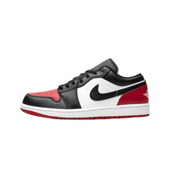 Nike Air Jordan 1 Low "Bred Toe" sneakers featuring a black and red leather upper with white accents. The low-top design includes a black swoosh and a white midsole, showcased against a neutral background to highlight the iconic colorway and classic silhouette.



