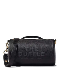 "Marc Jacobs Black The Duffle Crossbody Bag for women, featuring a sleek black design and a compact duffle shape. The bag includes an adjustable strap and a spacious interior, making it a stylish and practical accessory for daily use.



