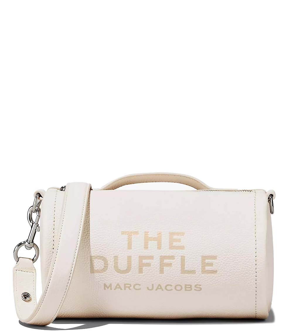  "Marc Jacobs Cotton Silver The Duffle Crossbody Bag for women, featuring a shiny silver finish and a compact duffle design. The bag includes an adjustable strap and a spacious interior, making it a stylish and functional accessory for everyday use."



