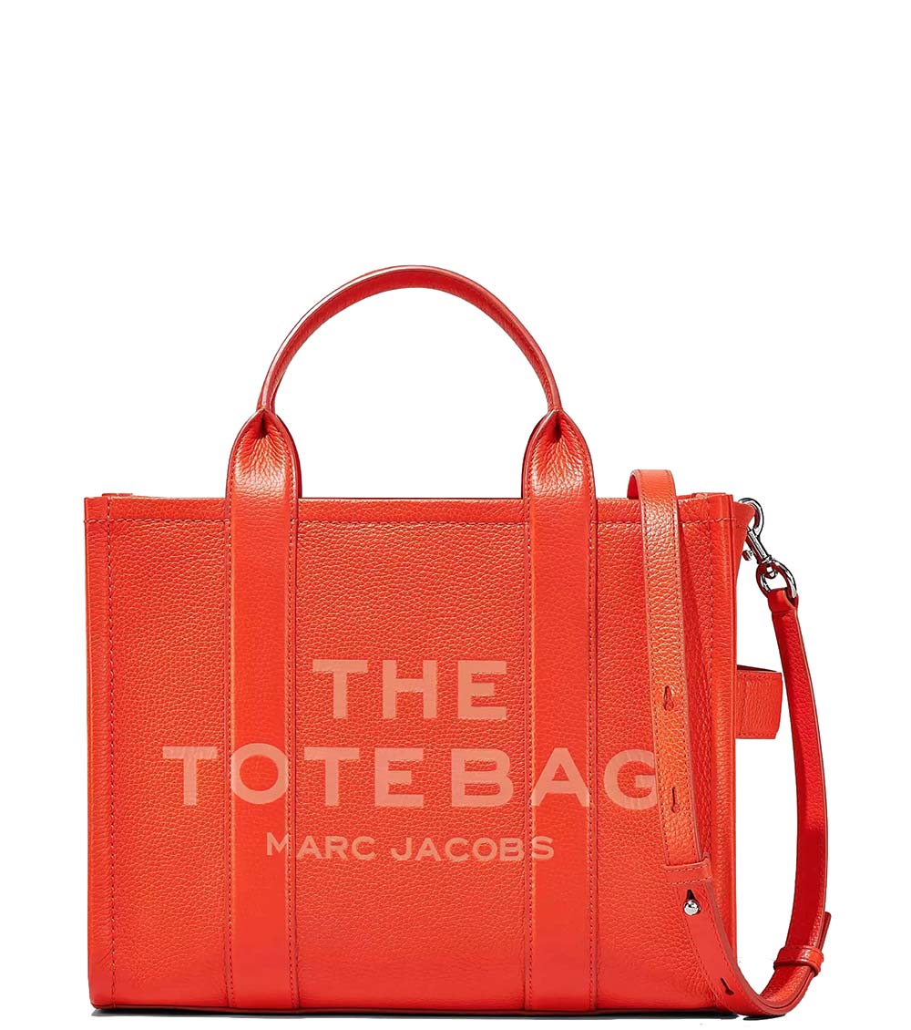 "Marc Jacobs Electric Orange The Tote Medium Satchel for women, featuring a bold electric orange color and a spacious design. The satchel includes sturdy top handles and a versatile interior, making it a striking and practical accessory for daily use."



