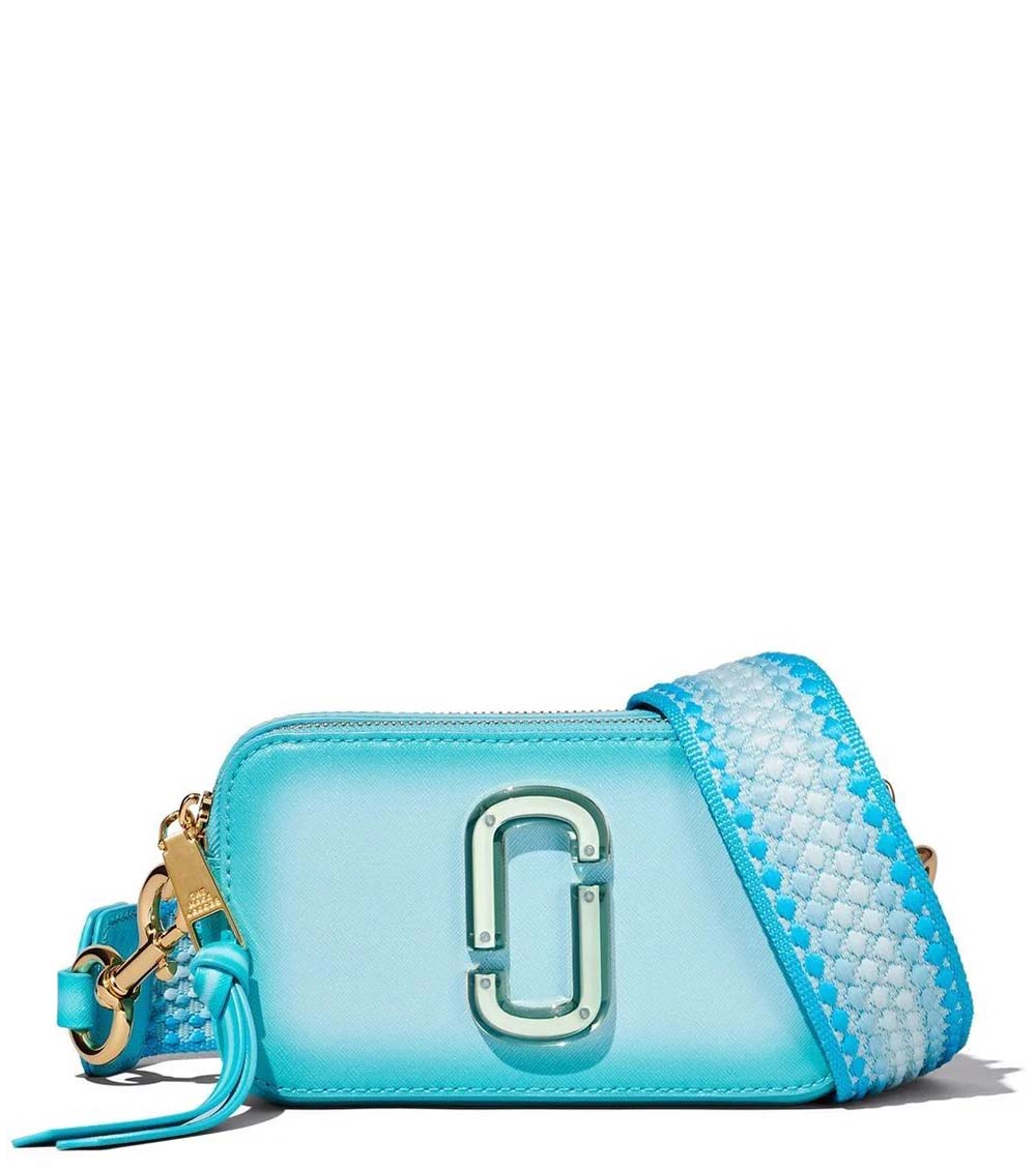 Marc Jacobs Light Blue Fluoro Edge Small Crossbody Bag for women, featuring a soft light blue color with vibrant fluoro edge detailing. The bag includes an adjustable strap and a compact design, making it a stylish and functional accessory for everyday use.



