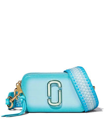 Marc Jacobs Light Blue Fluoro Edge Small Crossbody Bag for women, featuring a soft light blue color with vibrant fluoro edge detailing. The bag includes an adjustable strap and a compact design, making it a stylish and functional accessory for everyday use.



