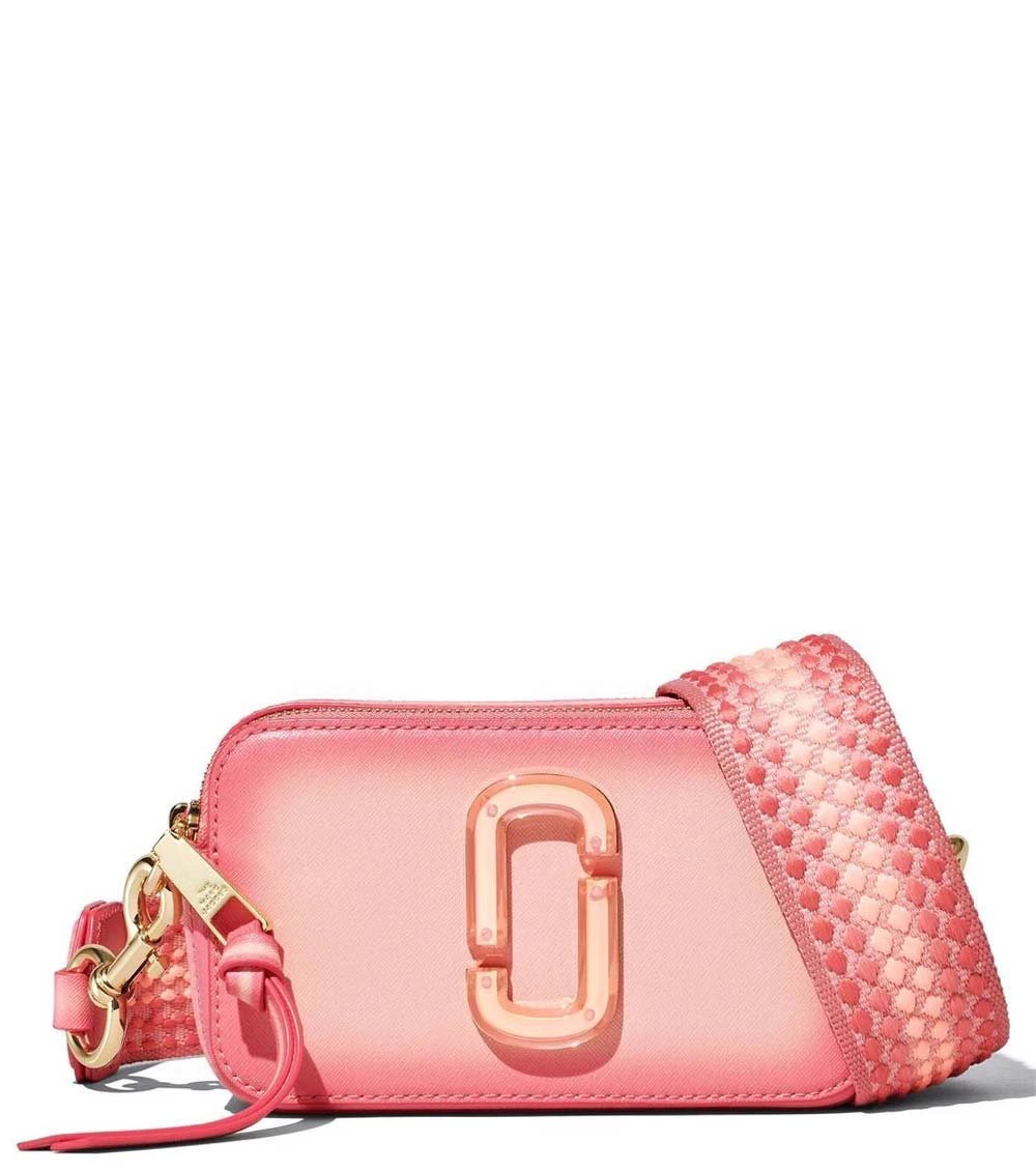 Marc Jacobs Peach Fluoro Edge Small Crossbody Bag for women, featuring a vibrant peach color with contrasting fluoro edge details. The bag includes an adjustable strap and a compact design, making it a stylish and functional accessory for on-the-go use."



