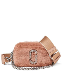 "Marc Jacobs Peach Plush Snapshot Small Crossbody Bag for women, featuring a soft peach color and a cozy plush texture. The bag includes an adjustable strap and the signature logo, making it a stylish and unique accessory for everyday use."



