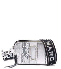 "Marc Jacobs Silver Striped Snapshot Small Crossbody Bag, featuring a sleek design with metallic silver stripes. The bag includes an adjustable strap and the signature logo, making it a stylish and eye-catching accessory for everyday use.



