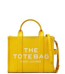 "Marc Jacobs Sun The Tote Medium Satchel for women, featuring a bright sun-yellow color and a spacious design. The satchel includes sturdy top handles and a versatile interior, making it a stylish and practical accessory for everyday use."



