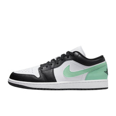 "Nike Air Jordan 1 Low sneakers in a striking green glow colorway, showcasing a low-top design with a mix of leather and suede materials, accented by white detailing on the midsole and laces."