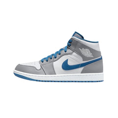 Nike Air Jordan 1 Mid "True Blue" sneakers featuring a combination of white leather with blue and black accents. The mid-top design includes a classic Air Jordan silhouette, a blue swoosh, and a white midsole, showcased against a clean background to highlight the vibrant color scheme.