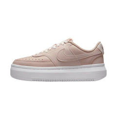 Nike Court Vision Alta Pink Oxford, sneakers in "Pink Oxford," featuring a soft pink leather upper with white accents. The design includes a low-top silhouette, perforated details for breathability, and a white midsole, displayed against a neutral background to emphasize the shoe's stylish and modern look.