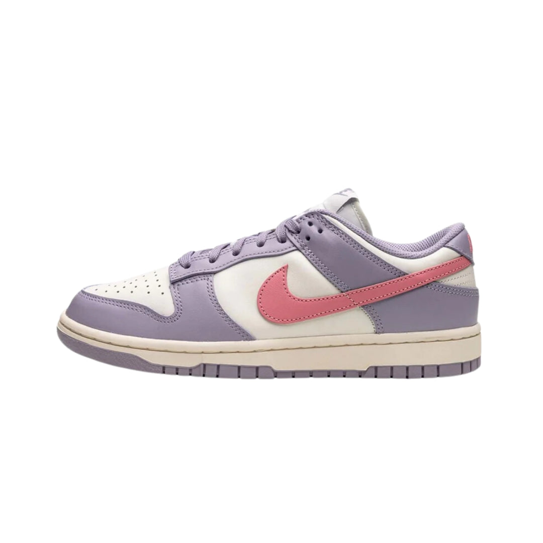 Nike Dunk Low "Indigo Haze" (Women’s) sneakers featuring a rich indigo blue leather upper with contrasting white accents. The classic low-top design includes a white midsole and matching laces, displayed against a neutral background to highlight the shoe's stylish color combination and modern appeal.



