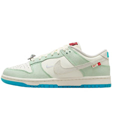  Nike Dunk Low LX "Cactus Sail" sneakers featuring a cream-colored leather upper with earthy green accents. The classic low-top design includes a white midsole and tonal laces, showcased against a neutral background to highlight the shoe's unique color palette and premium materials.