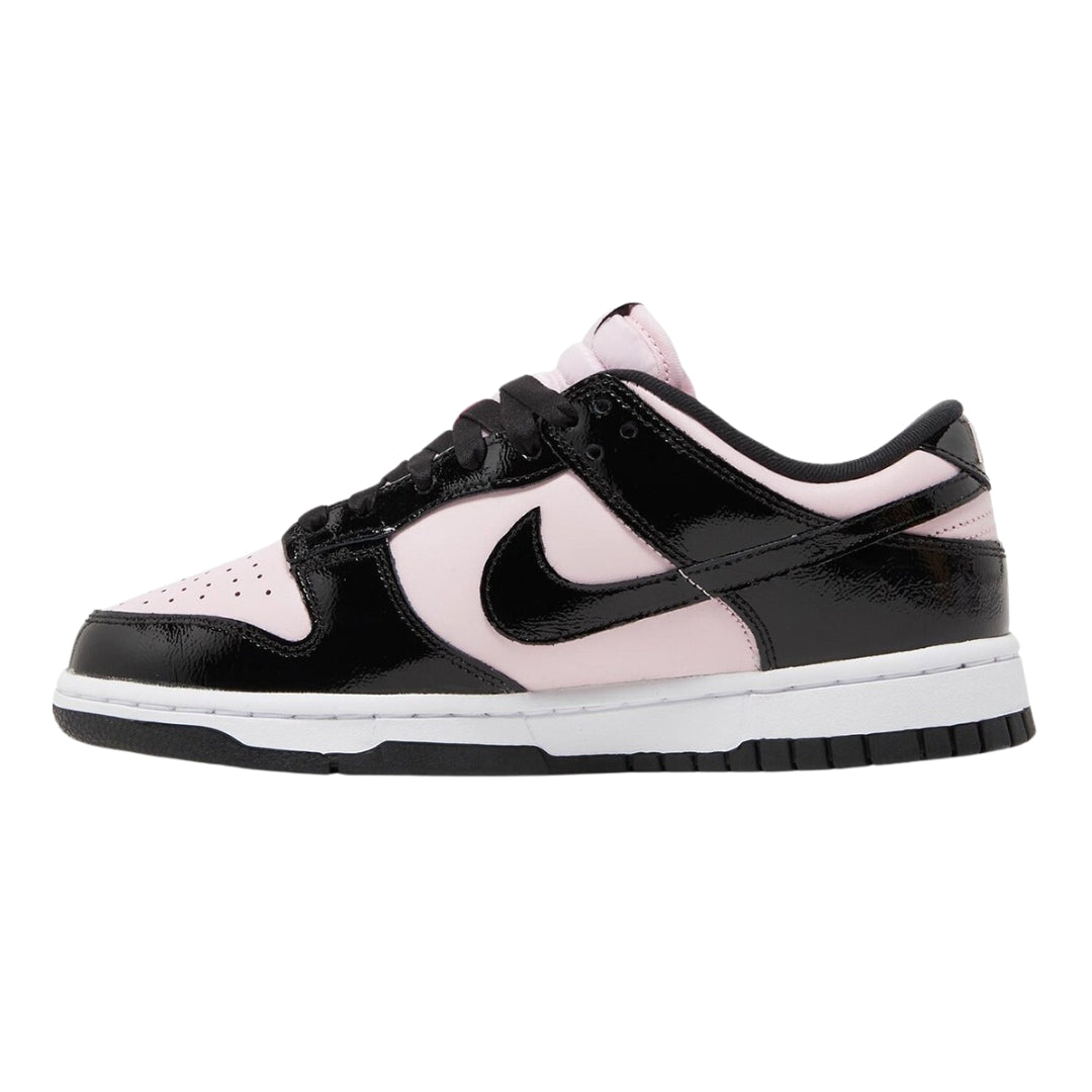 Nike Dunk Low "Pink Panda" sneakers featuring a soft pink leather upper with black accents. The classic low-top design includes a white midsole and matching laces, displayed against a neutral background to highlight the vibrant color contrast and playful aesthetic.



