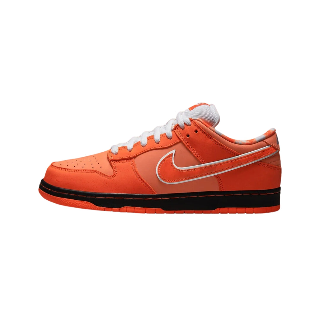 Nike SB Dunk Low "Concepts Orange Lobster" sneakers featuring a vibrant orange suede upper with contrasting red and white accents. The classic low-top design includes unique lobster-themed detailing and a white midsole, displayed in their regular box against a neutral background to highlight the shoe's playful and distinctive style.



