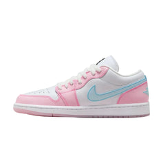 "Nike Air Jordan 1 Low sneakers in 'Pink Foam' colorway, showcasing a playful paw print design on the upper. The shoes feature a blend of soft pink and white tones, emphasizing their stylish silhouette against a simple background."