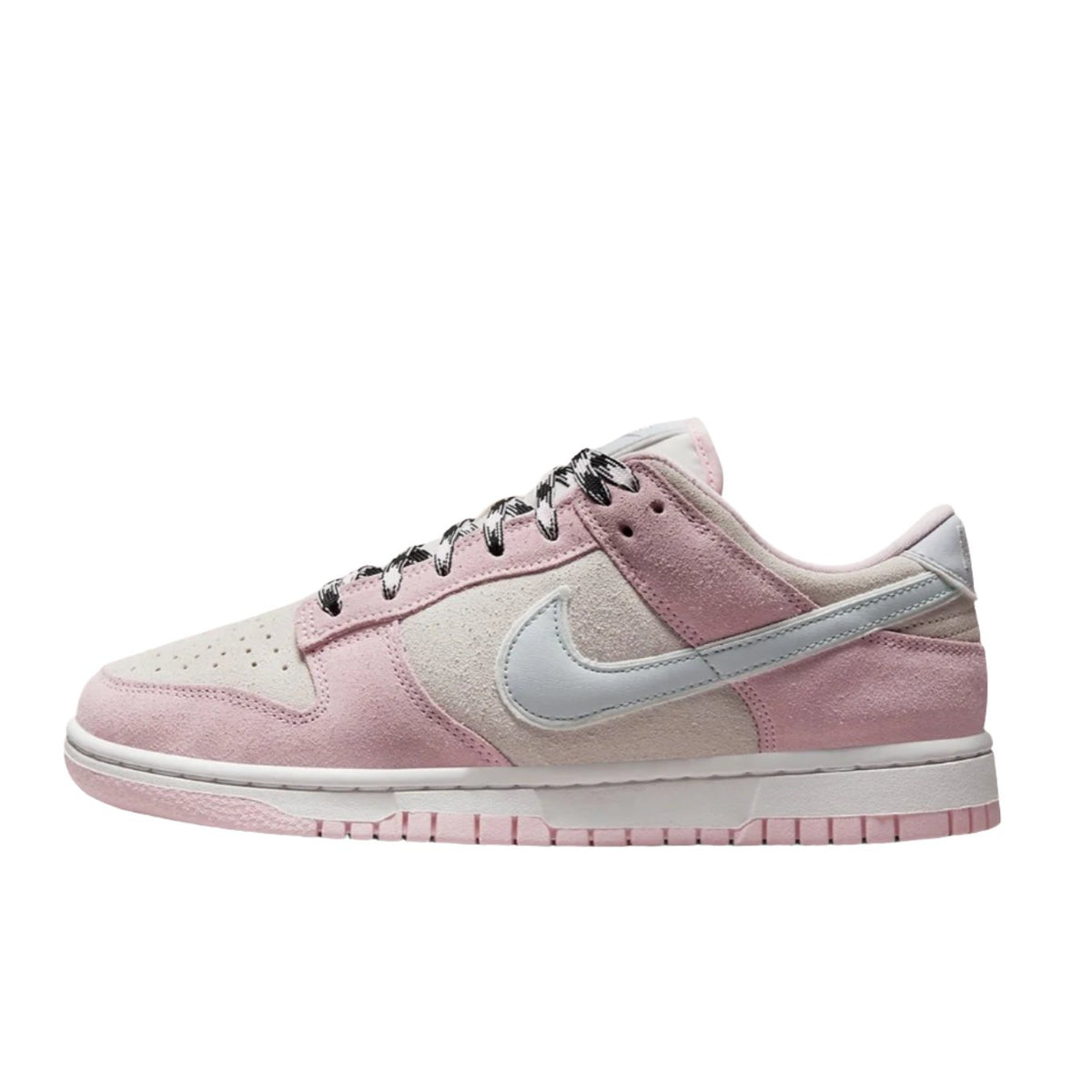 Nike Dunk Low LX "Pink Foam" (Women’s) sneakers featuring a soft pink leather upper with white accents. The classic low-top design includes a white midsole and matching laces, displayed against a neutral background to highlight the shoe's feminine colorway and stylish appeal.



