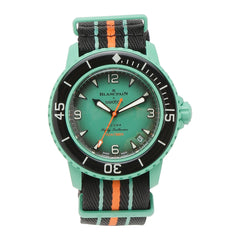 Swatch x Blancpain Bioceramic Scuba Fifty Fathoms 'Indian Ocean' watch, showcasing a vibrant turquoise and green color scheme inspired by the ocean's depths. The watch features a bioceramic case, prominent hour markers, and a rotating bezel, merging sporty functionality with elegant design."